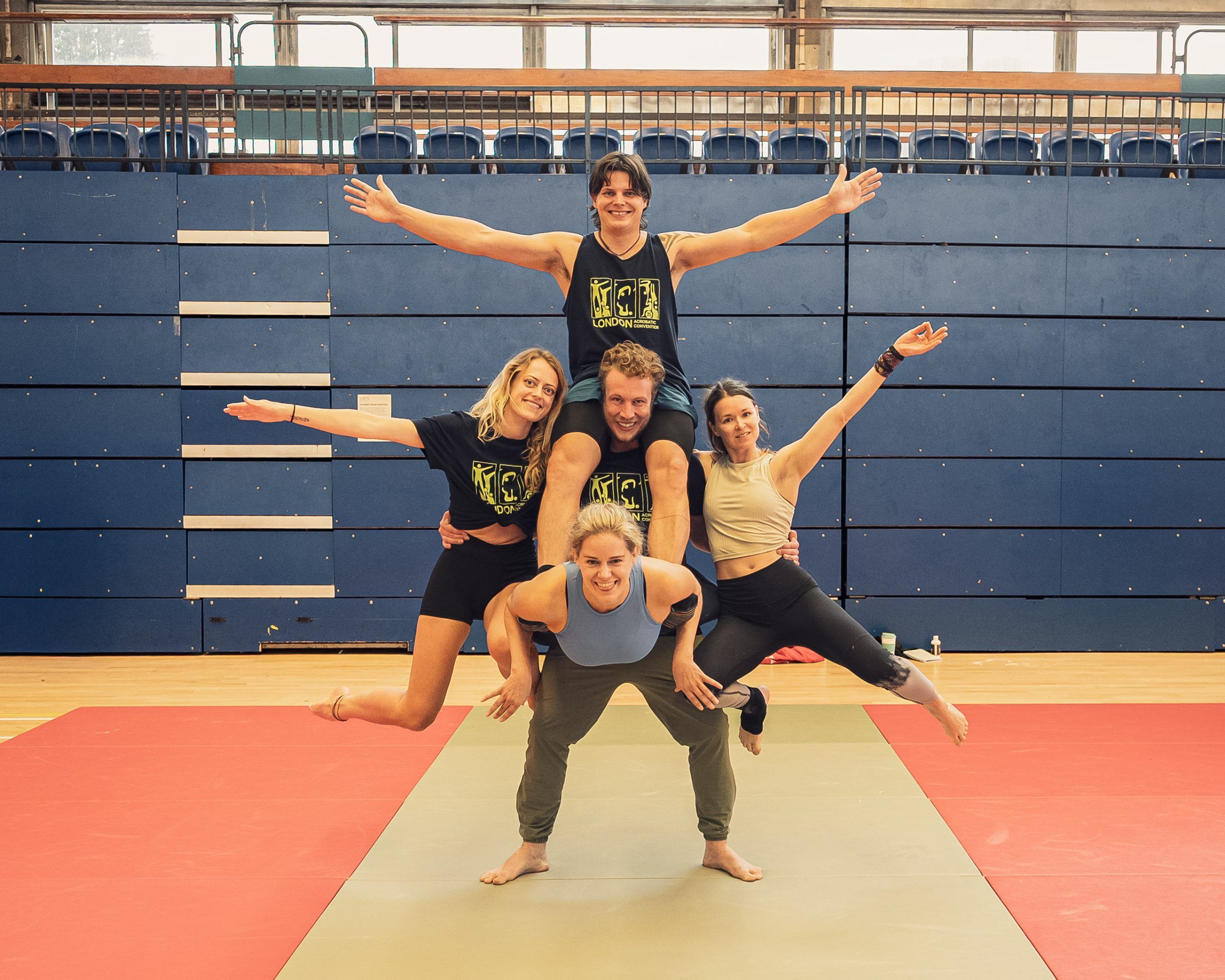 5 person standing group acro pose at lac 2025